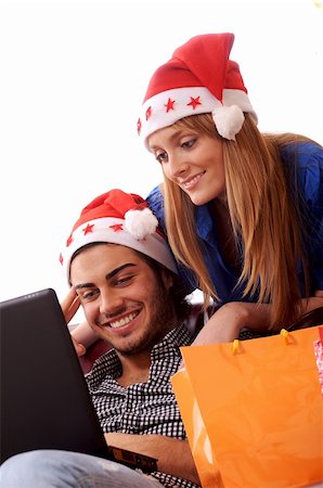 Boy and girl in Christmas on-line shopping on white background Stock Photo - Budget Royalty-Free & Subscription, Code: 400-05293435