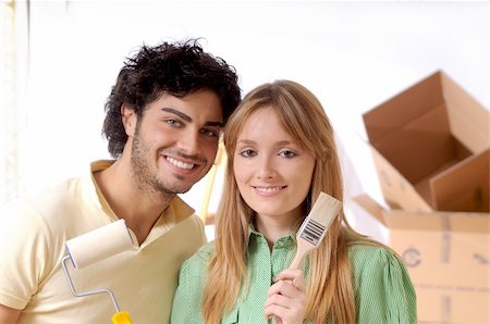 couple in new home with brush for to paint wall Stock Photo - Budget Royalty-Free & Subscription, Code: 400-05293432