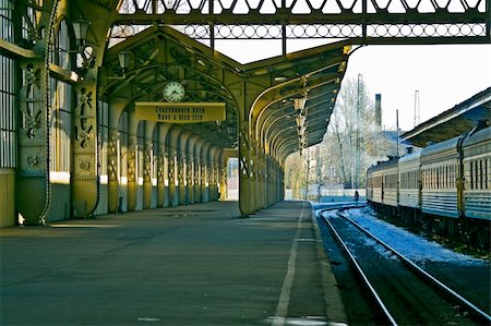 simsearch:649-08562431,k - Railroad station platform with a hanging clock and "Have a nice trip" signboard. Stock Photo - Budget Royalty-Free & Subscription, Code: 400-05293471