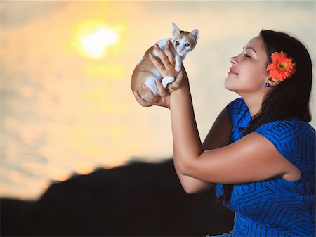 Woman with kitten outdoor at sunrise time Stock Photo - Budget Royalty-Free & Subscription, Code: 400-05293616