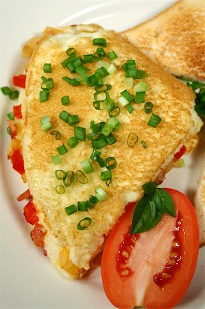 simsearch:400-05255035,k - Freshly cooked omelette with toast and tomato. Stock Photo - Budget Royalty-Free & Subscription, Code: 400-05304547