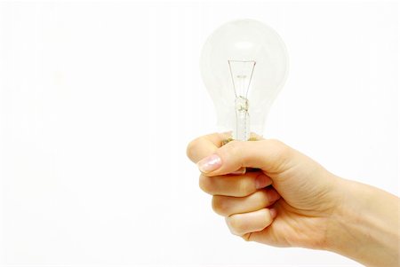 simsearch:400-04263435,k - Female hand holding bulb isolated on white background Photographie de stock - Aubaine LD & Abonnement, Code: 400-05304779