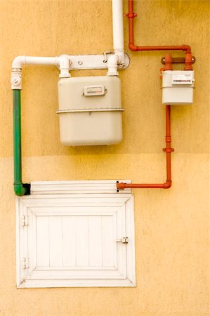 energy conservation and heat pump - yellow wall with gas pipe and gas counter Stock Photo - Budget Royalty-Free & Subscription, Code: 400-05304897