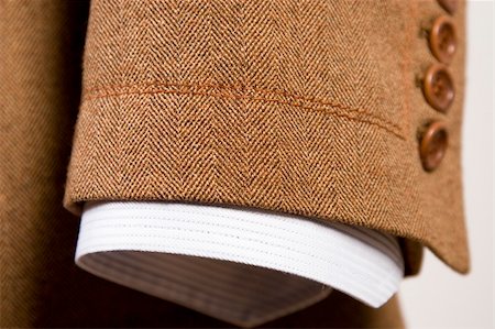 closeup of suit, detail of brown cuff and white shirt Stockbilder - Microstock & Abonnement, Bildnummer: 400-05304914