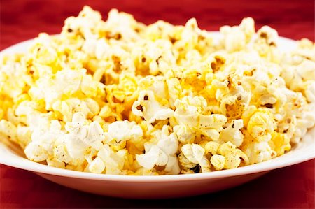 Bowl of popcorn on the table Stock Photo - Budget Royalty-Free & Subscription, Code: 400-05305361
