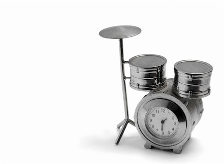 A mini silver alarm clock,  drums shape, isolated on white background Stock Photo - Budget Royalty-Free & Subscription, Code: 400-05305422