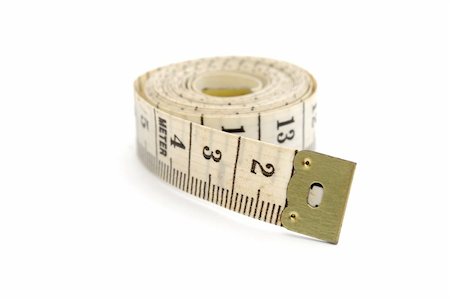 simsearch:640-01355019,k - Rolled measuring tape isolated on white background Stock Photo - Budget Royalty-Free & Subscription, Code: 400-05305530