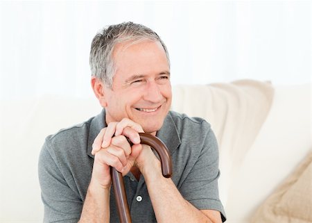 Mature man with his walking stick on his bed at home Stock Photo - Budget Royalty-Free & Subscription, Code: 400-05306087