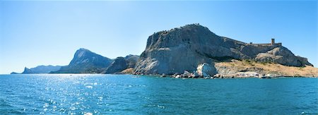 Summer rocky coastline and Genoese fortress (Sudak Town, Crimea, Ukraine). All peoples and cars is unrecognizable. Three shots stitch image. Stock Photo - Budget Royalty-Free & Subscription, Code: 400-05306106