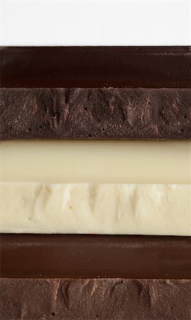 simsearch:400-08789726,k - Stack of Black, Brown and White Chocolate isolated on white background Photographie de stock - Aubaine LD & Abonnement, Code: 400-05306265