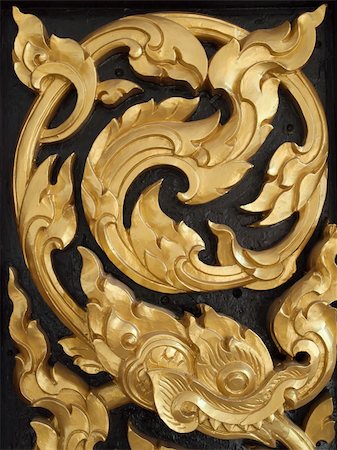 simsearch:400-05308012,k - Wood carvings is a form of Thai art and painted black paint over the designs with gold Fotografie stock - Microstock e Abbonamento, Codice: 400-05306289