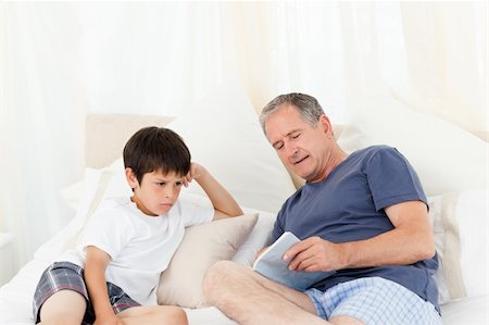 Young boy listening his grandfather Stock Photo - Budget Royalty-Free & Subscription, Code: 400-05306584