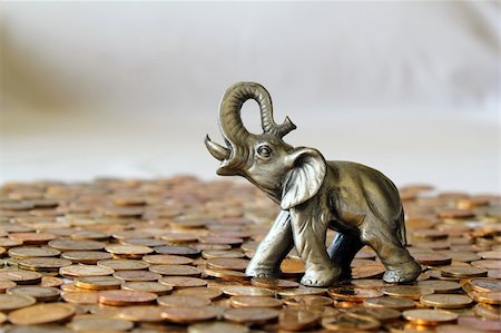 elephant figurines - Horisontal composition of silver elephant sitting on the heap of coins . Stock Photo - Budget Royalty-Free & Subscription, Code: 400-05307165
