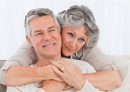 Mature woman hugging her husband at home Stock Photo - Budget Royalty-Free & Subscription, Code: 400-05307719