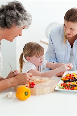 simsearch:400-04813285,k - Family cooking together in the kitchen at home Stock Photo - Budget Royalty-Free & Subscription, Code: 400-05307774