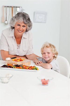 simsearch:400-04306517,k - Boy and his grandmother looking at the camera at home Stock Photo - Budget Royalty-Free & Subscription, Code: 400-05307776