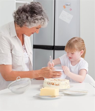 rolling over - Girl baking with her grandmother at home Stock Photo - Budget Royalty-Free & Subscription, Code: 400-05307777