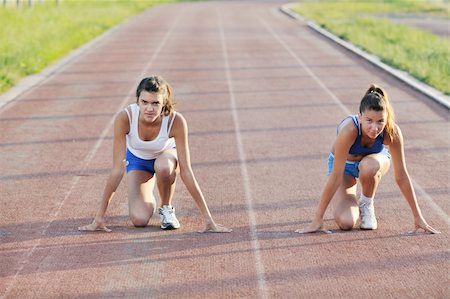 simsearch:400-05129335,k - young girl morning run and competition on athletic race track Stock Photo - Budget Royalty-Free & Subscription, Code: 400-05308998