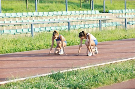 simsearch:400-05225597,k - young girl morning run and competition on athletic race track Fotografie stock - Microstock e Abbonamento, Codice: 400-05309000