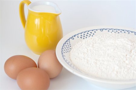 eggs milk - Pitcher of milk, eggs and flour on a white background Stock Photo - Budget Royalty-Free & Subscription, Code: 400-05309025
