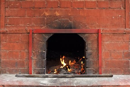 smoking room - Chinese temple of fire burning in the brick stove. Stock Photo - Budget Royalty-Free & Subscription, Code: 400-05309020