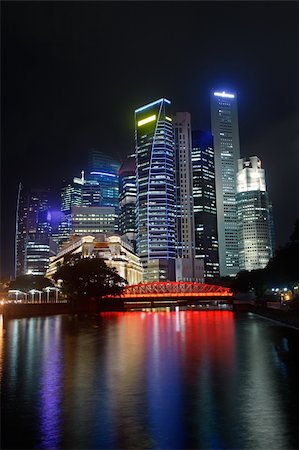 simsearch:400-06330815,k - Colorful city night with skyscrapers near river in Singapore, Asia. Foto de stock - Super Valor sin royalties y Suscripción, Código: 400-05309219