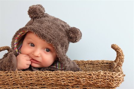 simsearch:400-05727835,k - Four month old baby boy wearing a fully bear suit Fotografie stock - Microstock e Abbonamento, Codice: 400-05309711