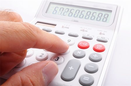 calculator showing business accounting concept in white Stock Photo - Budget Royalty-Free & Subscription, Code: 400-05300076