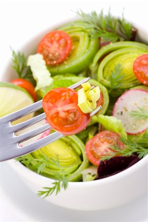 some bits of salad on the fork close up Photographie de stock - Aubaine LD & Abonnement, Code: 400-05300728