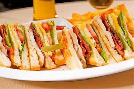 simsearch:400-07179775,k - fresh triple decker club sandwich with french fries on side Stock Photo - Budget Royalty-Free & Subscription, Code: 400-05301128
