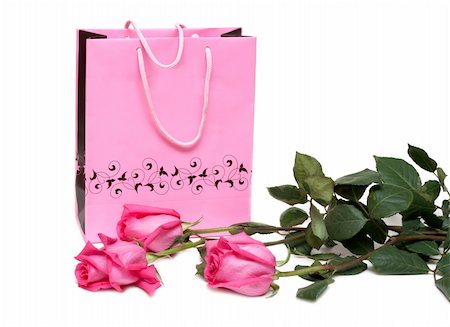 simsearch:400-05294518,k - Rose gift package and three roses on white background Fotografie stock - Microstock e Abbonamento, Codice: 400-05301586