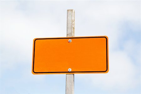 Bright orange road sign over cloudy sky Stock Photo - Budget Royalty-Free & Subscription, Code: 400-05301761