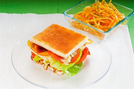 egg layer - fresh and delicious classic club sandwich over a transparent glass dish Stock Photo - Budget Royalty-Free & Subscription, Code: 400-05301802
