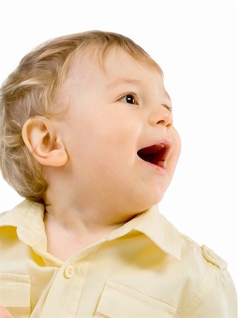 Portrait of happy boy laughing on a white background Fotografie stock - Microstock e Abbonamento, Codice: 400-05302196