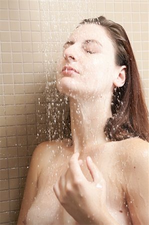 pictures of water glass and faucet - Sexy young adult Caucasian woman with long auburn hair and petite breasts taking a shower in a tile and glass modern bathroom. Stock Photo - Budget Royalty-Free & Subscription, Code: 400-05302546