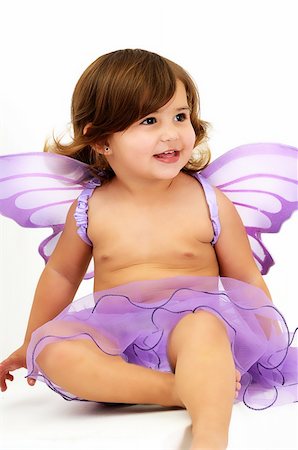 simsearch:400-04814756,k - little girl with purple angle wings sitting in studio and smiling Foto de stock - Super Valor sin royalties y Suscripción, Código: 400-05302731