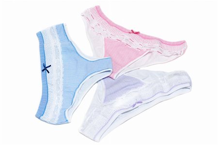 Three feminine striped lacy panties on white background Stock Photo - Budget Royalty-Free & Subscription, Code: 400-05303178
