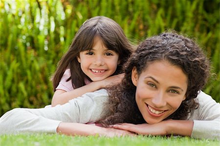 Adorable mother with her daughter in the garden Stock Photo - Budget Royalty-Free & Subscription, Code: 400-05314047