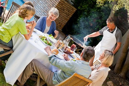 Lovely family eating in the garden Stock Photo - Budget Royalty-Free & Subscription, Code: 400-05314315