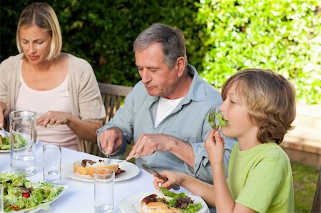 simsearch:400-04327229,k - Adorable family eating in the garden Stock Photo - Budget Royalty-Free & Subscription, Code: 400-05314316