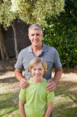 simsearch:400-06097548,k - Boy with his Grandfather looking at the camera Photographie de stock - Aubaine LD & Abonnement, Code: 400-05314334