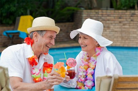 Happy senior couple drinking cocktails and toasting each other Stock Photo - Budget Royalty-Free & Subscription, Code: 400-05314411