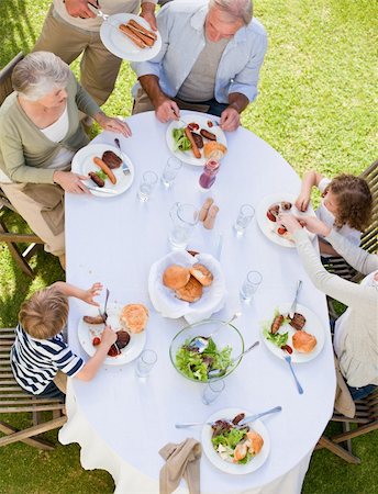 simsearch:400-04327229,k - Family eating in the garden Stock Photo - Budget Royalty-Free & Subscription, Code: 400-05314515