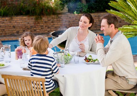 simsearch:400-04327229,k - Family eating in the garden Stock Photo - Budget Royalty-Free & Subscription, Code: 400-05314512