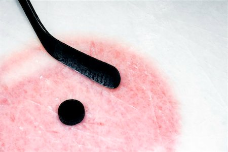 Hockey sport background: graphite stick and puck on real arena used and scratched ice. Fotografie stock - Microstock e Abbonamento, Codice: 400-05314599