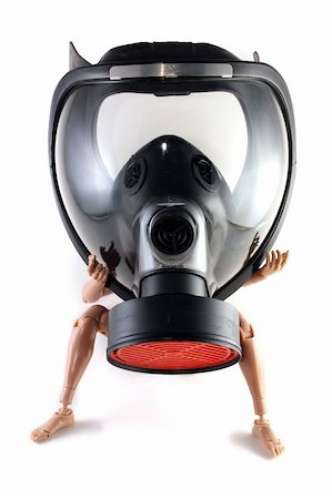 A toy figure wearing a black gas mask Stock Photo - Budget Royalty-Free & Subscription, Code: 400-05314590