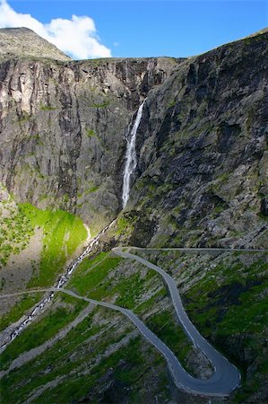 simsearch:400-05259799,k - Trollstigen (The Troll Path) is a mountain road in Rauma, Norway. It is a popular tourist attraction due to its steep incline and eleven hairpin bends up a steep mountain side. Fotografie stock - Microstock e Abbonamento, Codice: 400-05314676