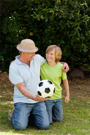 Grandfather and his grandson looking at the camera Stock Photo - Budget Royalty-Free & Subscription, Code: 400-05314673
