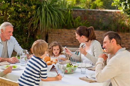 simsearch:400-04327229,k - Family eating in the garden Stock Photo - Budget Royalty-Free & Subscription, Code: 400-05314716