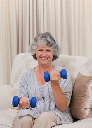 family stress at hospital - Woman doing her exercises on her sofa Stock Photo - Budget Royalty-Free & Subscription, Code: 400-05314732